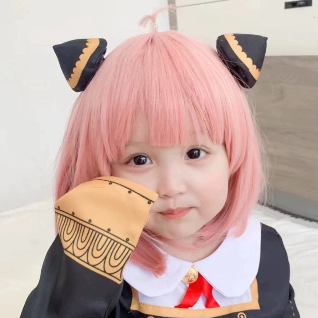 Anya-inspired pink bob wig styled with black cat-ear accessories