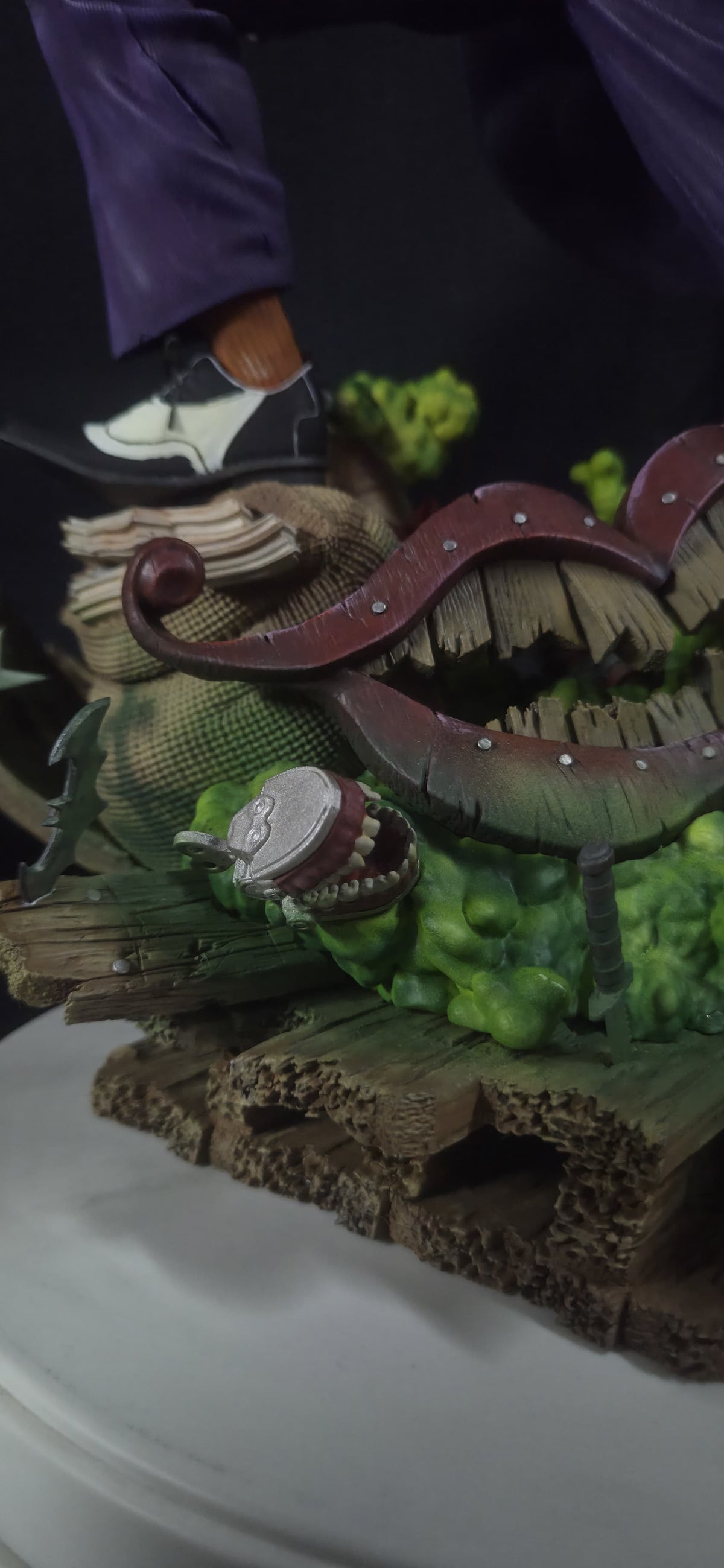 Close-up of the Joker statue diorama base and details