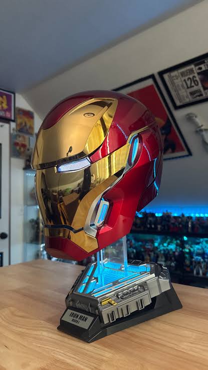 Iron Man MK50 helmet on display stand with illuminated details