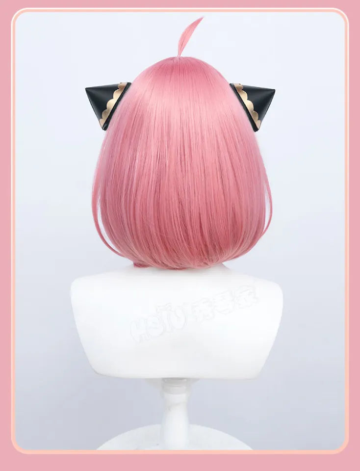 Back view of pink Anya Forger inspired cosplay wig with black and gold hair accessories
