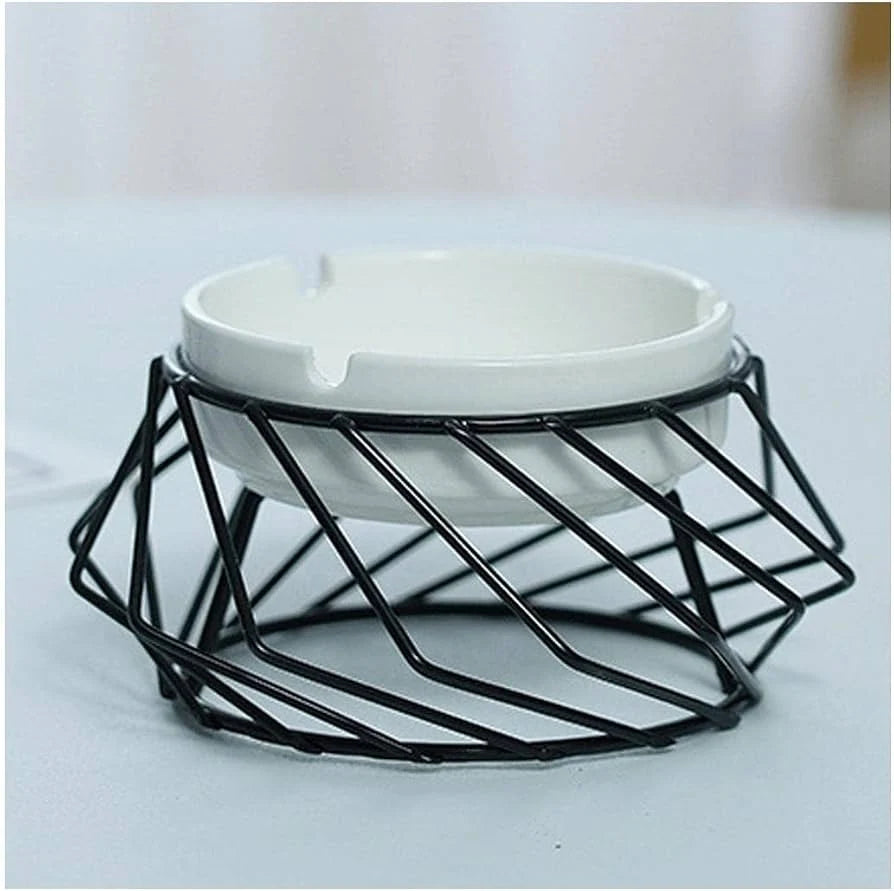 White ceramic ashtray in geometric black metal wire holder