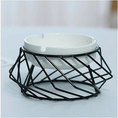 White ceramic ashtray in geometric black metal wire holder