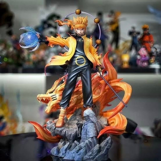 Naruto Uzumaki statue with orange Kurama chakra effects and rocky display base